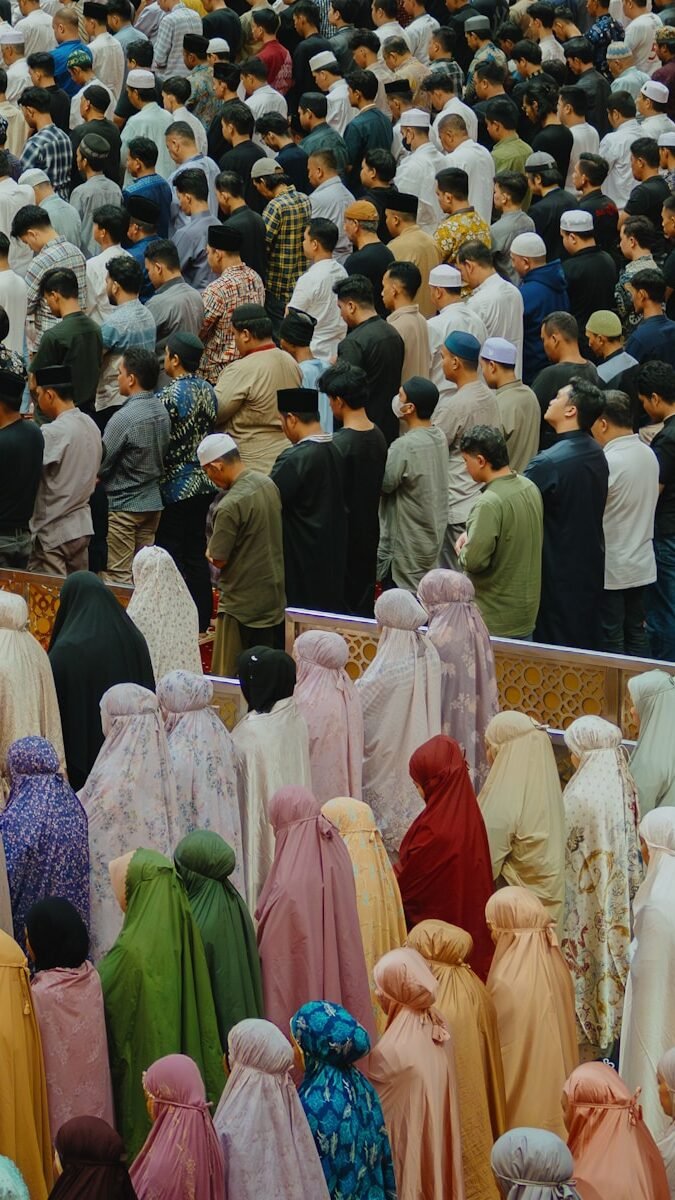 A large group of people standing in front of a crowd